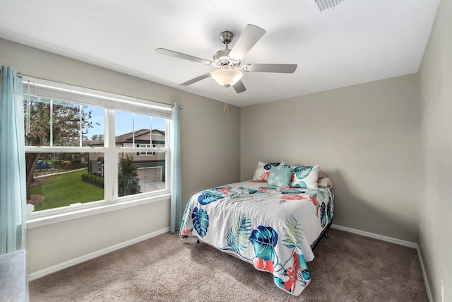 carpeted bedroom featuring ceiling fan