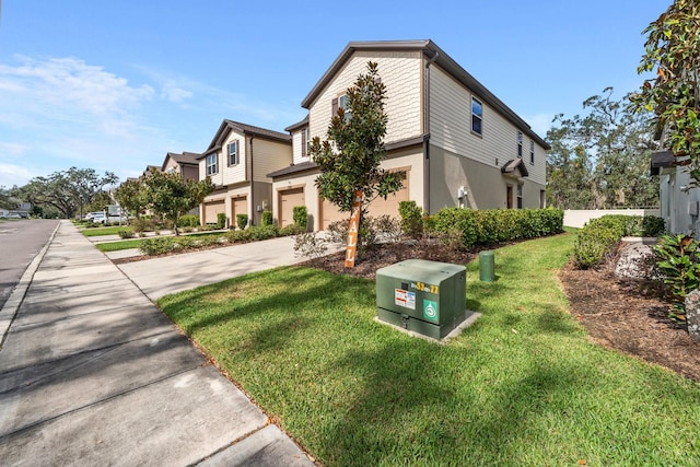 exterior space with a front lawn and a garage