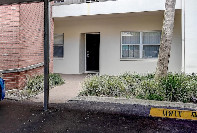 doorway to property featuring a balcony