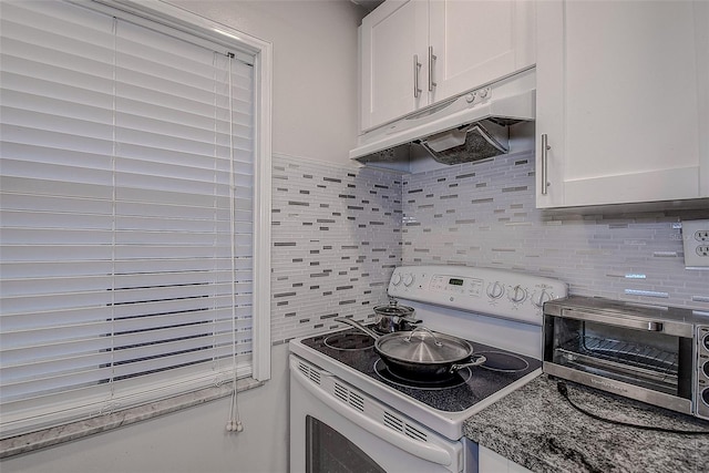 kitchen featuring white cabinetry, electric range, and tasteful backsplash