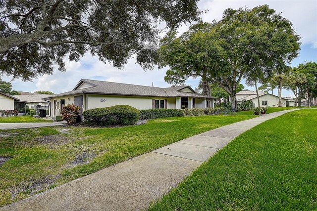 single story home with a front yard