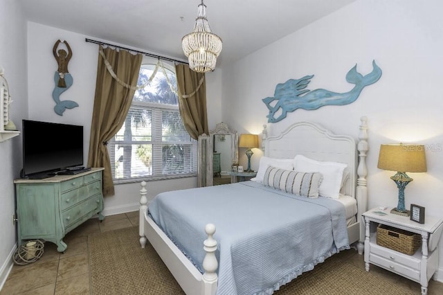 tiled bedroom with a chandelier