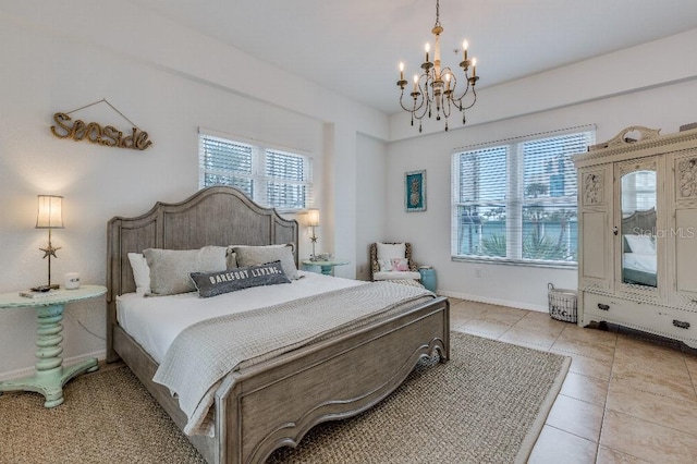 bedroom with an inviting chandelier and light tile patterned floors