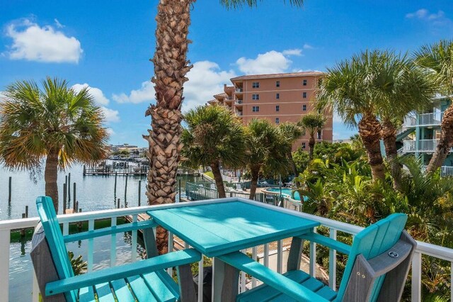 exterior space featuring a dock and a water view