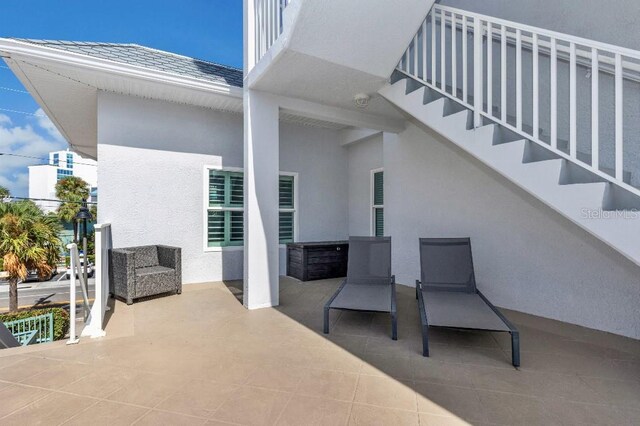 view of patio featuring a balcony