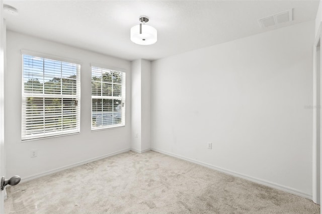 unfurnished room with carpet flooring