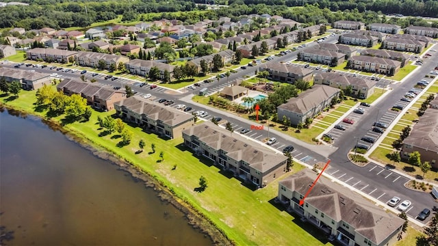 birds eye view of property with a water view