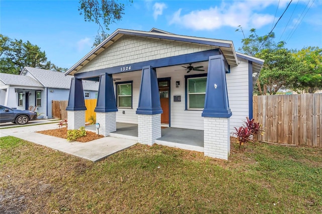 view of front of house with a porch and a front yard