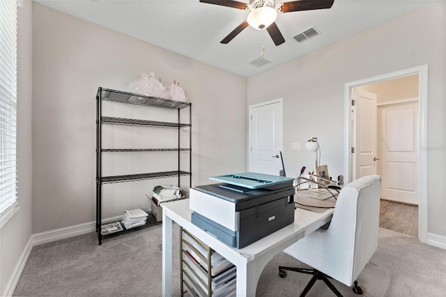 office area featuring light colored carpet and ceiling fan