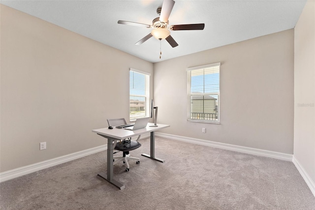 office area with ceiling fan and light colored carpet