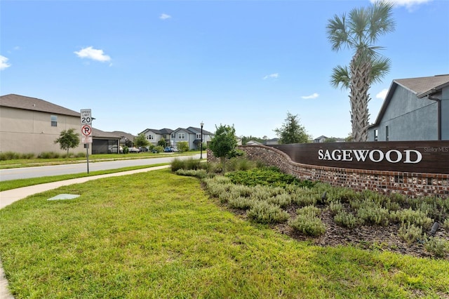 community sign with a lawn