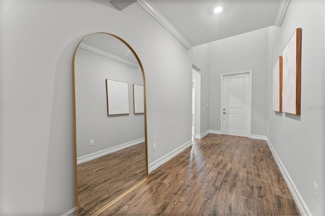 entrance foyer with hardwood / wood-style floors and crown molding