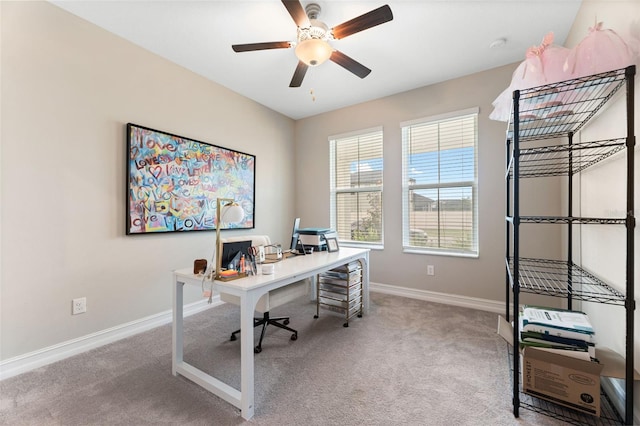 carpeted office with ceiling fan