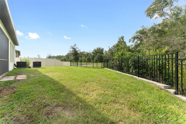 view of yard featuring central AC