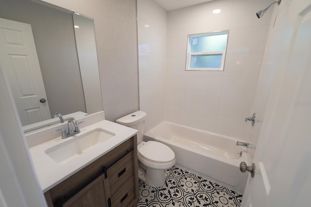 full bath with shower / bath combination, tile patterned flooring, vanity, and toilet