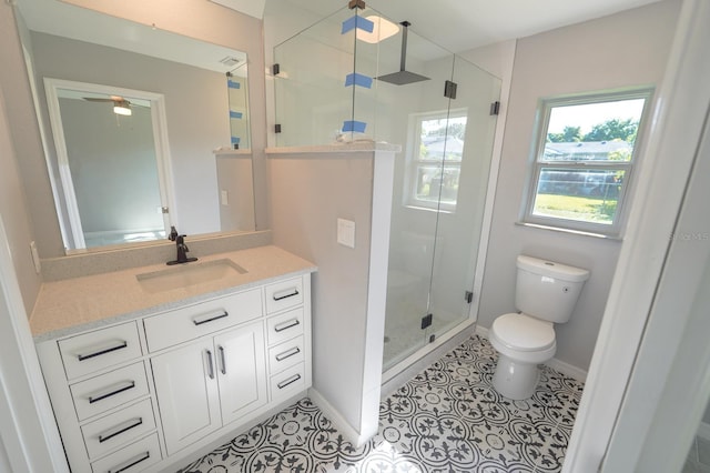 full bathroom featuring baseboards, a shower stall, vanity, and tile patterned floors