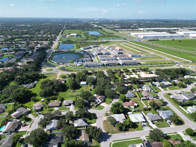 aerial view with a residential view and a water view