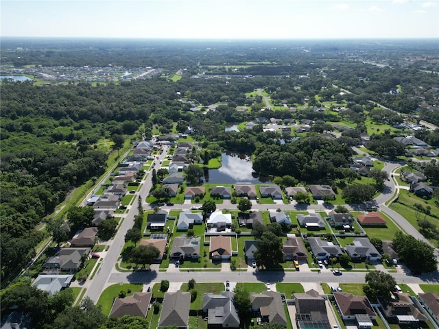 birds eye view of property featuring a residential view and a water view