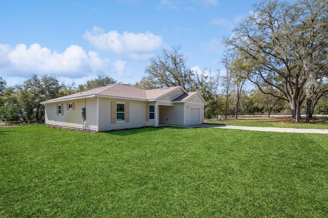 exterior space with a lawn and a garage