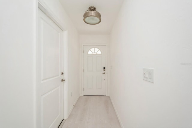 doorway to outside with light hardwood / wood-style floors