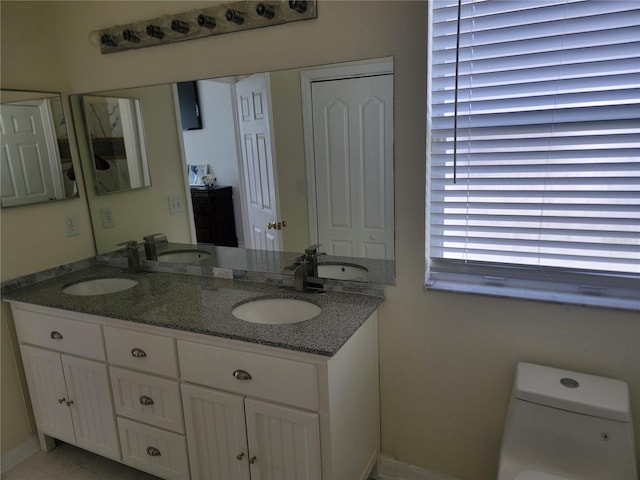 bathroom with vanity and toilet