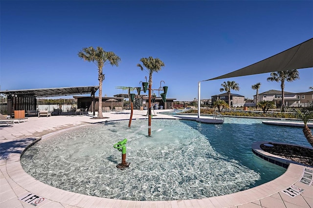 view of swimming pool featuring pool water feature