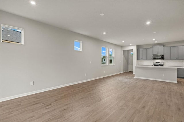 unfurnished living room featuring light hardwood / wood-style flooring