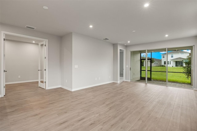 empty room with light wood-type flooring