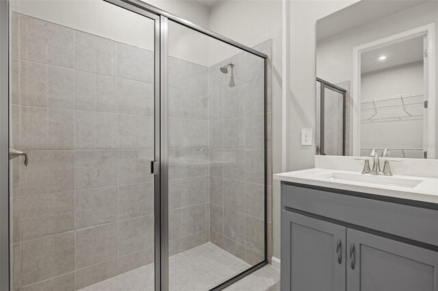 bathroom featuring an enclosed shower and vanity