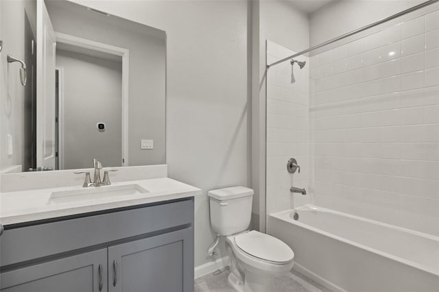 full bathroom with toilet, tiled shower / bath combo, and vanity