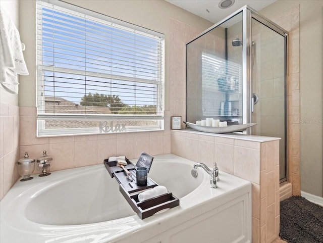 bathroom featuring plus walk in shower