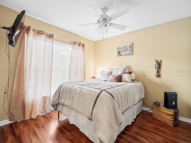 bedroom with ceiling fan and hardwood / wood-style floors