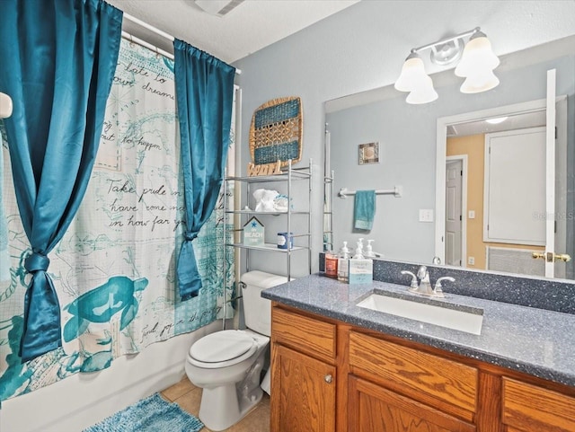 full bathroom with toilet, vanity, tile patterned floors, a textured ceiling, and shower / tub combo with curtain