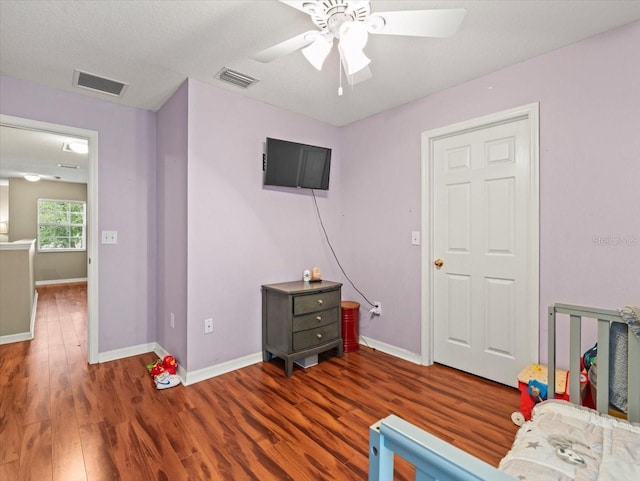 bedroom featuring ceiling fan and wood-type flooring