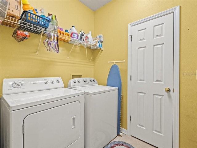 clothes washing area with washing machine and clothes dryer