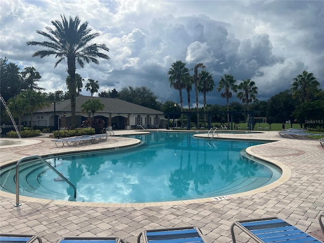 view of swimming pool with a patio