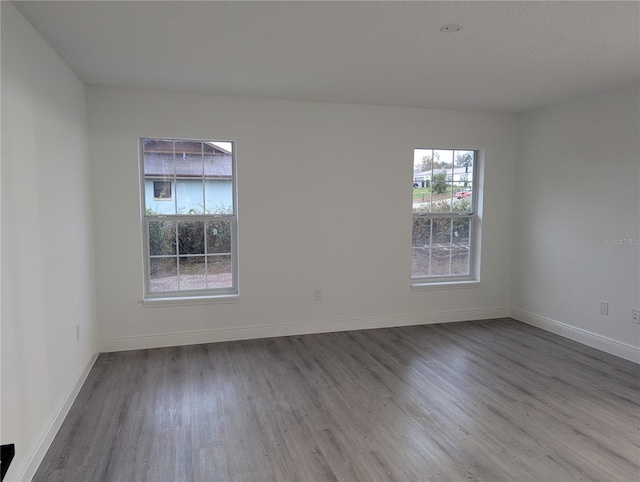 empty room featuring hardwood / wood-style flooring