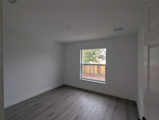 unfurnished room featuring hardwood / wood-style floors