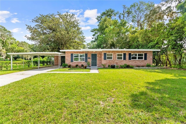 ranch-style home with concrete driveway, a front lawn, an attached carport, and brick siding