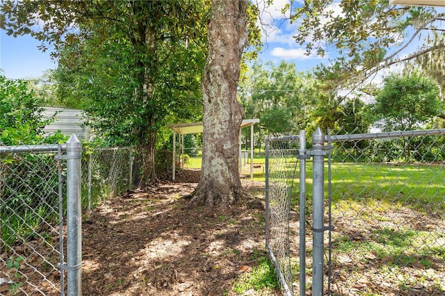 view of yard with a gate and fence