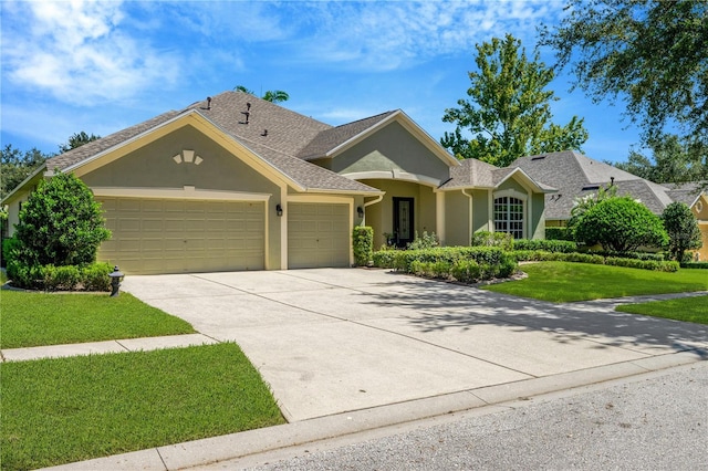 ranch-style house featuring a front yard and a garage