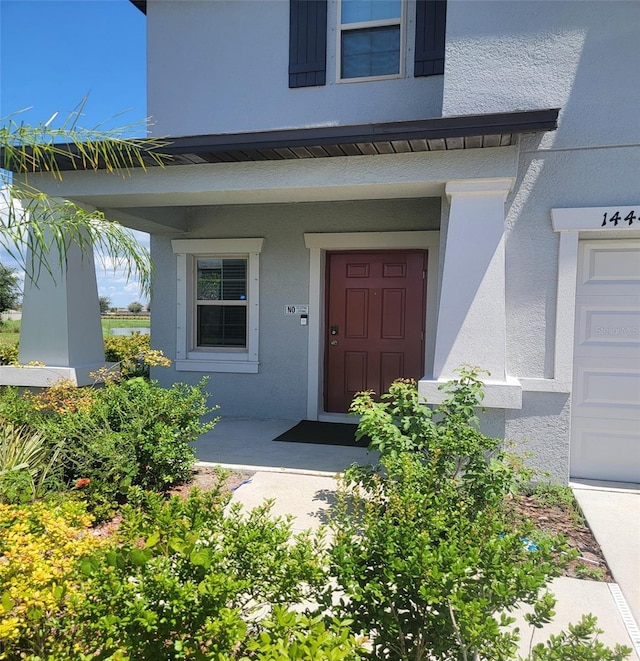 14443 Touch Gold Ln, Sun City Center, FL 33573 - entrance to property with stucco siding and covered porch