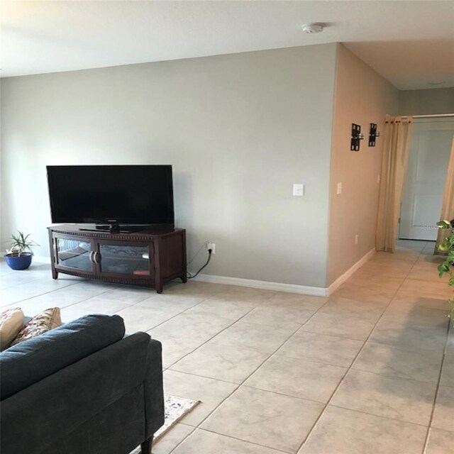 14443 Touch Gold Ln, Sun City Center, FL 33573 - living area featuring light tile patterned flooring and baseboards
