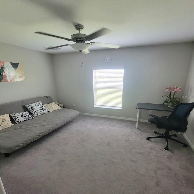 interior space featuring ceiling fan and carpet flooring