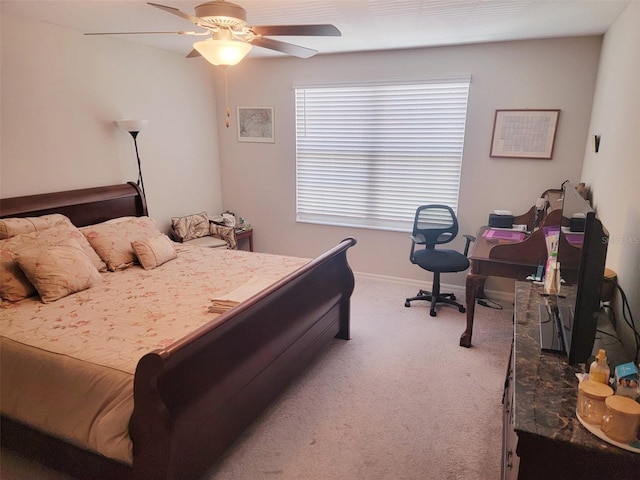 14443 Touch Gold Ln, Sun City Center, FL 33573 - carpeted bedroom with baseboards and a ceiling fan