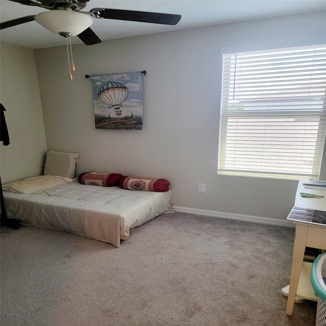 bedroom with ceiling fan and carpet flooring