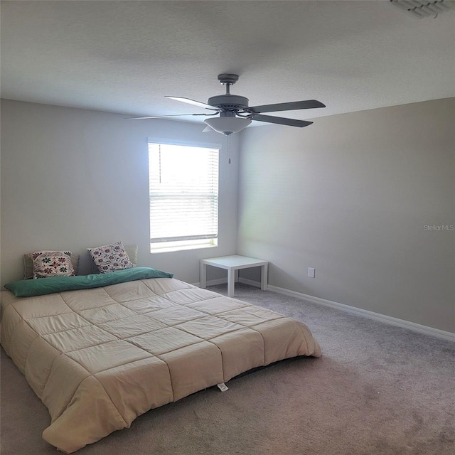 14443 Touch Gold Ln, Sun City Center, FL 33573 - carpeted bedroom with visible vents, ceiling fan, and baseboards