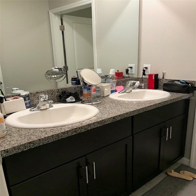 bathroom featuring double vanity