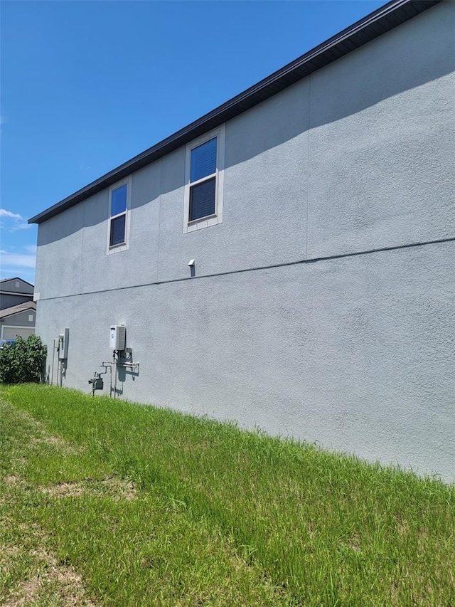 14443 Touch Gold Ln, Sun City Center, FL 33573 - view of side of property featuring stucco siding