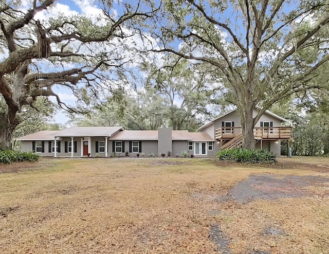 view of front of home with a wooden deck